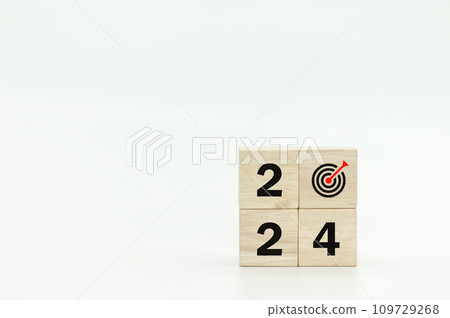 Wooden cubes with 2024 and goal icon on white background. Wooden cubes with 2024 and goal icon on white background. 109729268