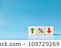 Wooden cube block with icon percentage symbol and arrow up  down 109729269