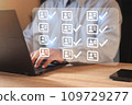 Businessman using laptop computer with correct tick sign mark  109729277