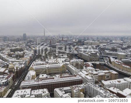 Aerial View of Berlin, Capital of Germany from above. Aerial winter cityscape of central part, Foggy cold Downtown. Aerial View of Berlin, Capital of Germany from above. Aerial winter cityscape of central part, Foggy cold Downtown. 109731650