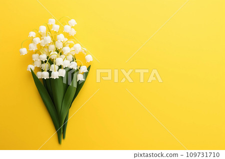 Lily of the valey bunch on yellow background top view 109731710