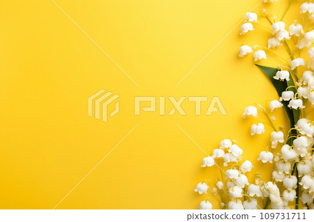 Lily of the valey bunch on yellow background top view 109731711