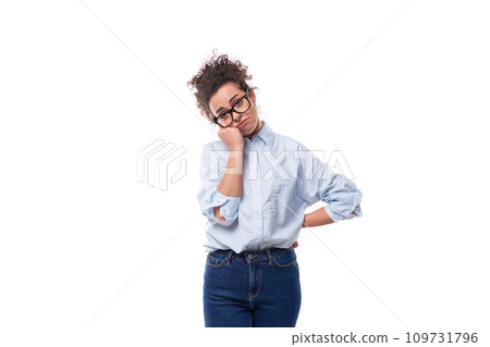 portrait of a young smiling fashionista caucasian woman working in the office who puts on glasses portrait of a young smiling fashionista caucasian woman working in the office who puts on glasses 109731796