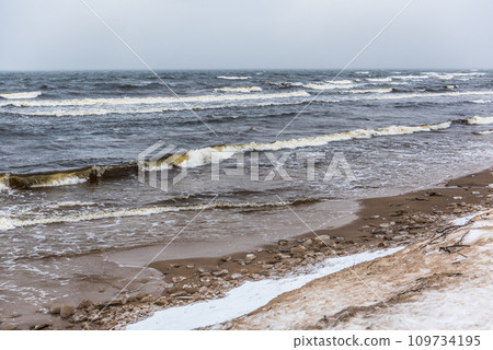 Baltic Sea snowy beach, big waves in the sea on winter 109734195