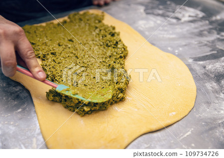 Baker make stuffed sweet bread 109734726