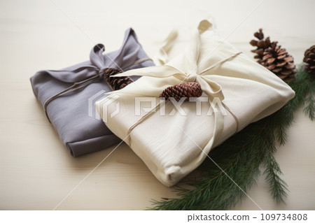 Christmas gift. Packaging in eco-friendly materials, furoshiki fabric. Bokeh, selective focus 109734808