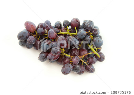 Bunch of organic black grapes isolated on white background. Bunch of organic black grapes isolated on white background. 109735176