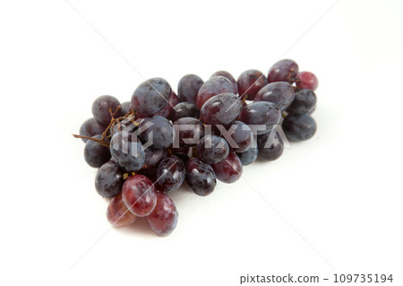 Bunch of organic black grapes isolated on white background. 109735194