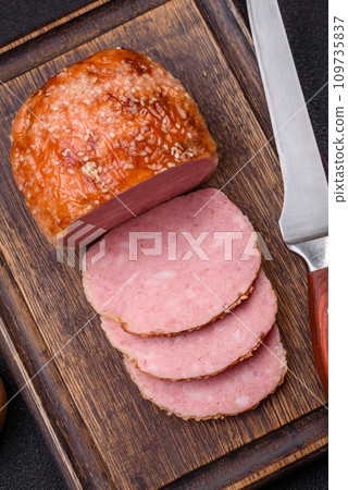 Delicious baked chicken or turkey meat roll with salt and spices 109735837