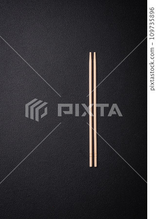 White wooden chopsticks for Asian dishes with copy space 109735896