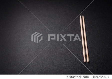 White wooden chopsticks for Asian dishes with copy space 109735897