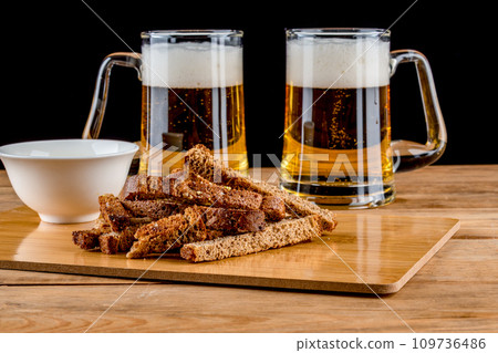 Garlic croutons made from toasted bread and sauce make a delicious beer snack. Garlic croutons made from toasted bread and sauce make a delicious beer snack. 109736486