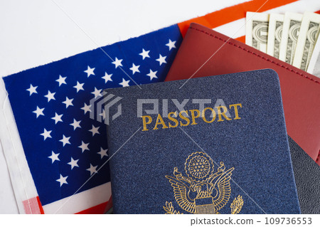 US passport on USA flag, American citizen in United States of America. 109736553