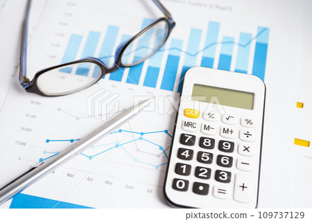 Calculator on chart graph paper. Finance, account, statistic, investment data economy, stock exchange business. 109737129