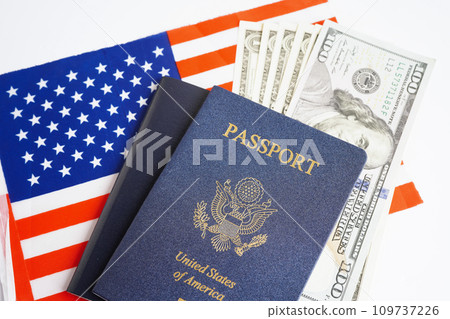 US passport with dollar money on USA flag, American citizen in United States of America. US passport with dollar money on USA flag, American citizen in United States of America. 109737226