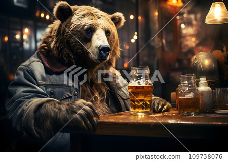 A large furry brown bear was sitting in a bar drinking a drink. Whether you consider it honey or beer is up to the viewer's imagination. Some people like to complain that it's like a bear eating honey 109738076