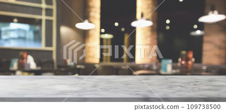 marble table top with blurred abstract cafe restaurant interior background marble table top with blurred abstract cafe restaurant interior background 109738500