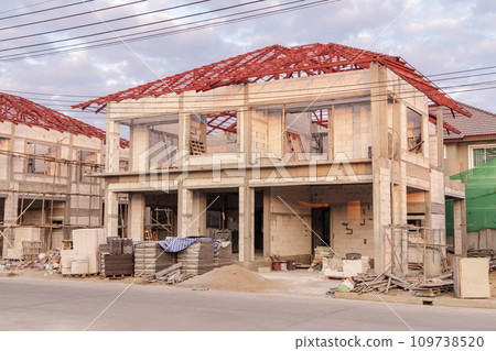 construction residential new house in progress at building site construction residential new house in progress at building site 109738520