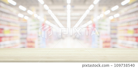 Wood table top with supermarket grocery store blurred background with bokeh light for product display Wood table top with supermarket grocery store blurred background with bokeh light for product display 109738540