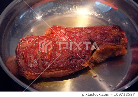 Roasted beef. Meat is frying in a pan. Homemade food. Closeup. Roasted beef. Meat is frying in a pan. Homemade food. Closeup. 109738587