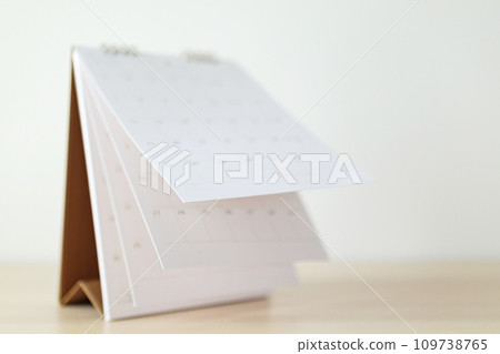 Calendar page flipping sheet on wood table background business schedule planning appointment meeting concept 109738765