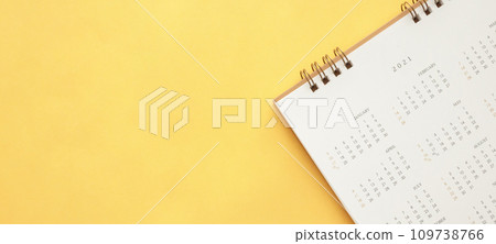 2021 calendar page on yellow color background business planning appointment meeting concept 2021 calendar page on yellow color background business planning appointment meeting concept 109738766
