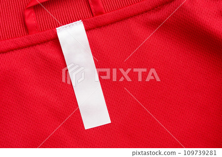 White blank clothes label on red jersey texture background White blank clothes label on red jersey texture background 109739281