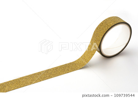 Gold glitter tape roll on white background Gold glitter tape roll on white background 109739544