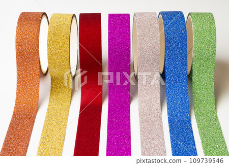 colorful glitter tape rolls strips on white background colorful glitter tape rolls strips on white background 109739546