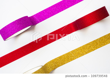 colorful glitter tape rolls strips on white background 109739548