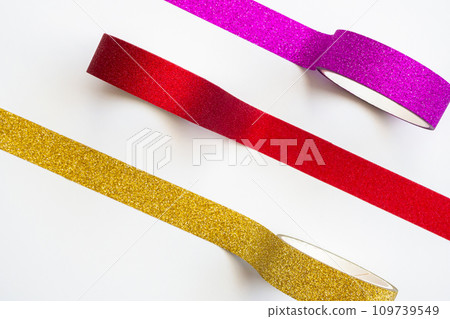 colorful glitter tape rolls strips on white background 109739549