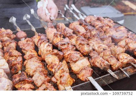 Kebabs cooked outdoors with skewers hot grills in traditional Turkish style 109739752