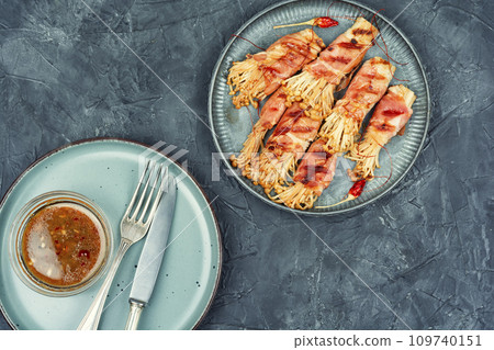 Bacon rolls stuffed with enoki mushroom. Bacon rolls stuffed with enoki mushroom. 109740151