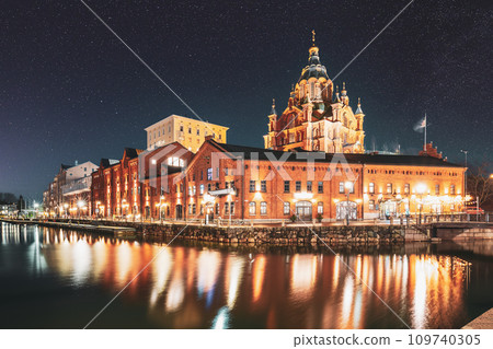Helsinki, Finland. Bright Blue Starry Sky. View Of Kanavaranta Street With Uspenski Cathedral In Evening Night Illuminations. Dark Blue Dramatic Sky With Shining Stars. Azure Color Sky Helsinki, Finland. Bright Blue Starry Sky. View Of Kanavaranta Street With Uspenski Cathedral In Evening Night Illuminations. Dark Blue Dramatic Sky With Shining Stars. Azure Color Sky 109740305