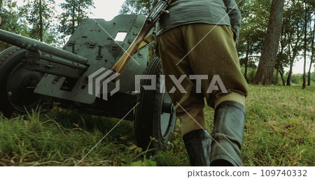 Preparing For Combat Historical Reenactment. Group Of Re-enactors Dressed As Russian Soviet Red Army Infantry Soldiers Of World War Ii Are Move Soviet 45mm Anti-tank Gun To Combat Position 109740332