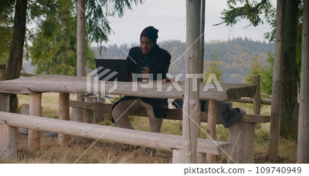 Tourist remotely consults business partners during vacation 109740949