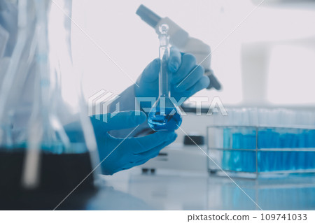 biochemical research scientist team working with microscope for coronavirus vaccine development in pharmaceutical research labolatory, selective focus biochemical research scientist team working with microscope for coronavirus vaccine development in pharmaceutical research labolatory, selective focus 109741033