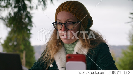 Traveler in glasses remotely consults clients during vacation Traveler in glasses remotely consults clients during vacation 109741130