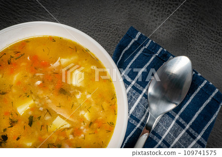 Barley soup with vegetables and chicken. 109741575