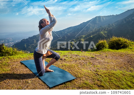 Woman doing Ashtanga Vinyasa yoga advanced asana 109741601