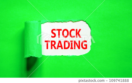 Stock trading symbol. Concept words Stock trading on beautiful white paper. Beautiful green paper background. Business stock trading concept. Copy space. 109741888