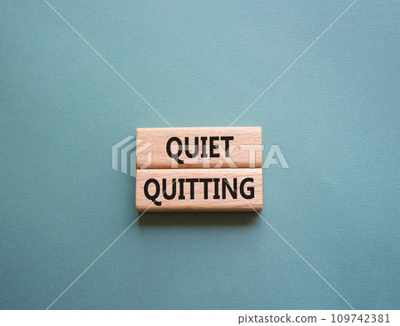 Quiet quitting symbol. Concept word Quiet quitting on wooden blocks. Beautiful grey green background. Business and Quiet quitting concept. Copy space. Quiet quitting symbol. Concept word Quiet quitting on wooden blocks. Beautiful grey green background. Business and Quiet quitting concept. Copy space. 109742381