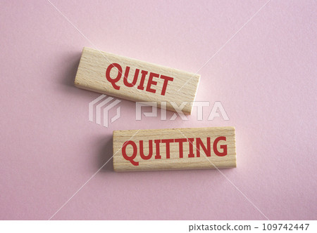 Quiet quitting symbol. Concept word Quiet quitting on wooden blocks. Beautiful pink background. Business and Quiet quitting concept. Copy space. 109742447