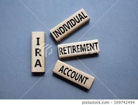 IRA - Individual Retirement Account symbol. Concept word IRA on wooden blocks. Beautiful grey background. Business and IRA concept. Copy space. IRA - Individual Retirement Account symbol. Concept word IRA on wooden blocks. Beautiful grey background. Business and IRA concept. Copy space. 109742494