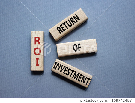 ROI - Return of Investment. Wooden cubes with words ROI. Beautiful grey background. Business and ROI concept. Copy space. ROI - Return of Investment. Wooden cubes with words ROI. Beautiful grey background. Business and ROI concept. Copy space. 109742498