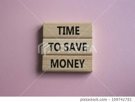 Time to save money symbol. Wooden blocks with words Time to save money. Beautiful pink background. Business and Time to save money concept. Copy space. 109742781