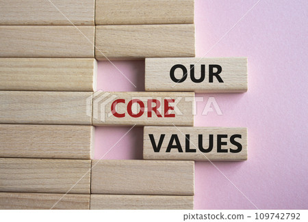 Our core values symbol. Concept words Our core values on wooden blocks. Beautiful pink background. Business and Our core values concept. Copy space. 109742792