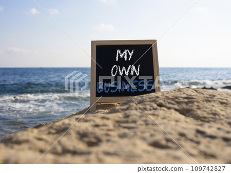My own Business symbol. Concept words My own Business on chalk blackboard. Beautiful sea background. Business and My own Business concept. Copy space. My own Business symbol. Concept words My own Business on chalk blackboard. Beautiful sea background. Business and My own Business concept. Copy space. 109742827