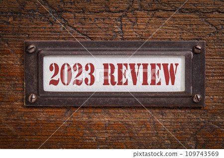 2023 review - a label on grunge wooden file cabinet. A passing year evaluation, summary and review concept. 2023 review - a label on grunge wooden file cabinet. A passing year evaluation, summary and review concept. 109743569