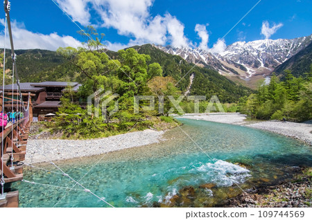《Kamikochi during the fresh green season》 Hotaka mountain range with remaining snow seen from Kappa Bridge 《Kamikochi during the fresh green season》 Hotaka mountain range with remaining snow seen from Kappa Bridge 109744569